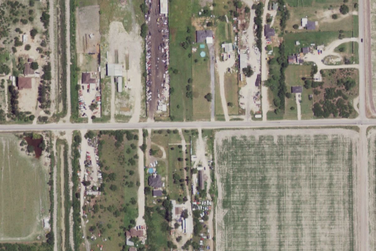 Aerial photo of Mac Auto Parts at 5124 Mile 12 N