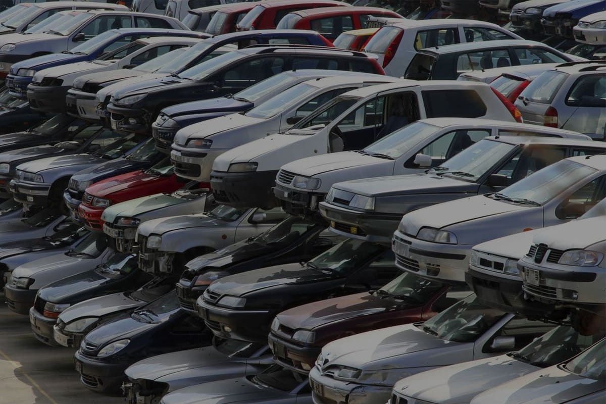 West Auto Sales & Salvage: Rows of salvage cars parked closely together in a large auto salvage yard